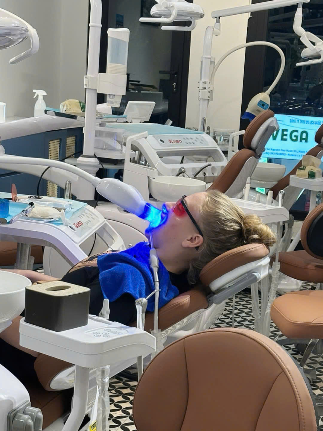 Happy patient with a beautiful smile after dental implant treatment