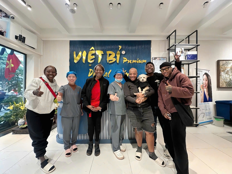 Satisfied dental implant patient smiling after treatment at Viet Bi Dental Vietnam