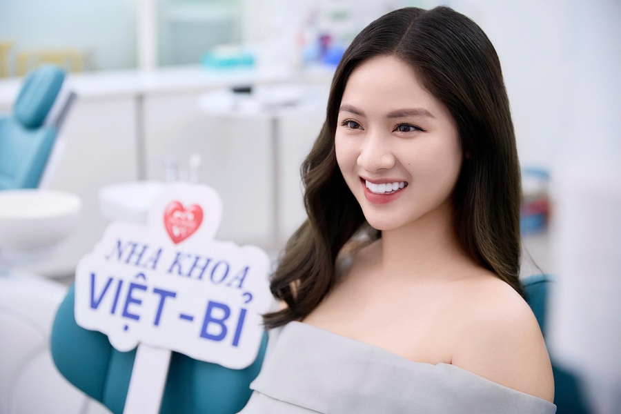 Happy patient after smile makeover dental holiday Vietnam